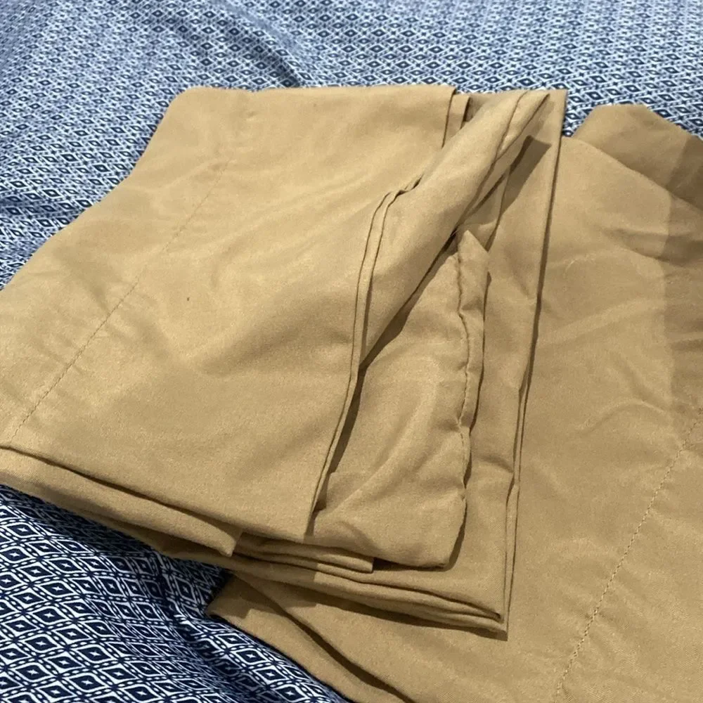 Queen size pillowcases flat, and fitted sheet in a gold color